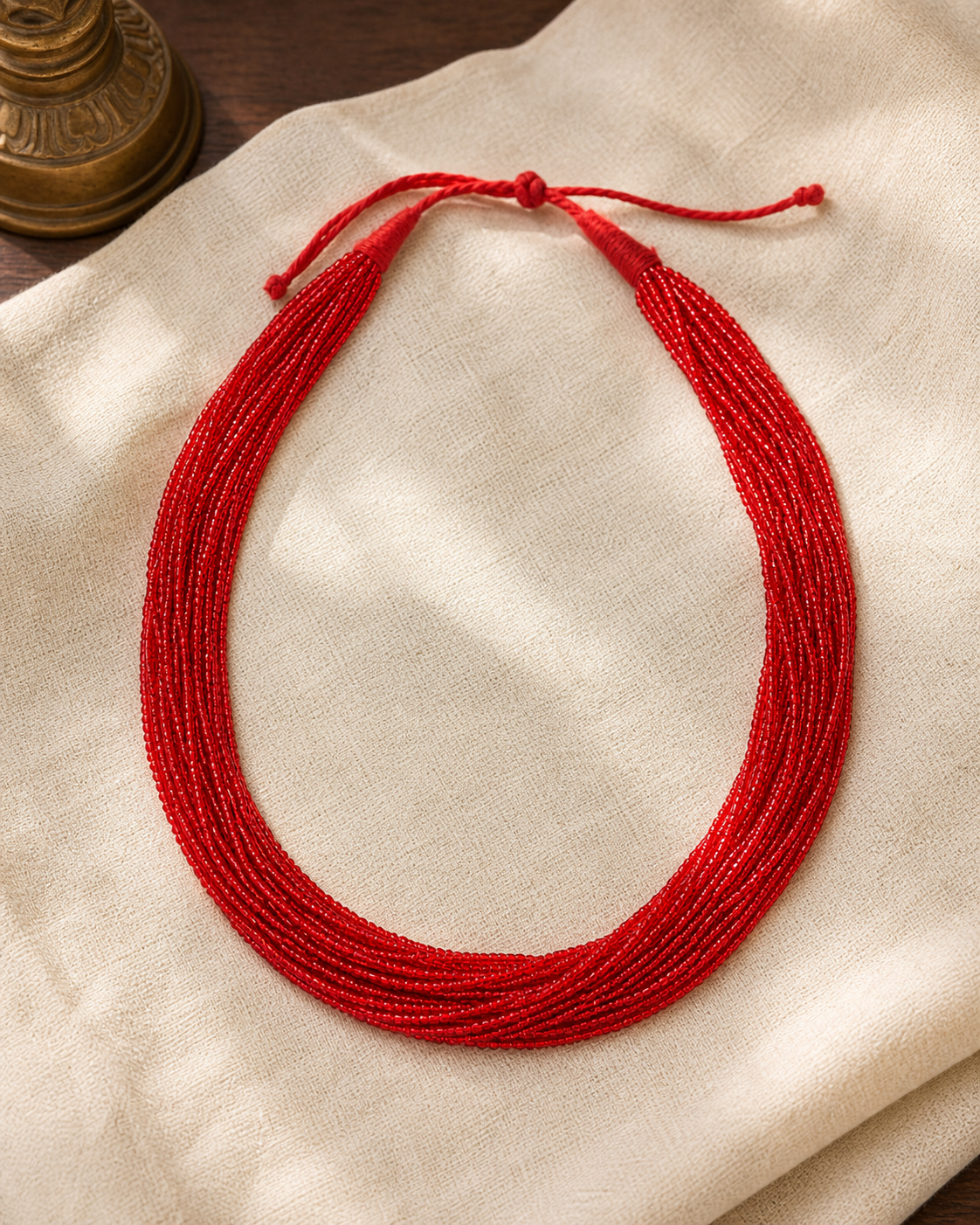 Multi-strand traditional vermillion red glass potey necklace